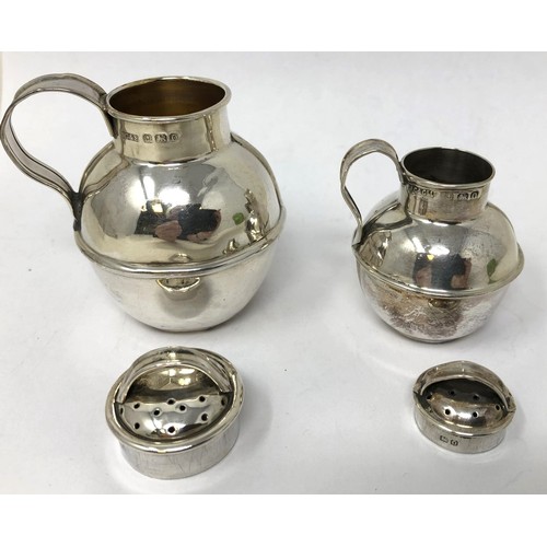 112 - A silver pepperette, in the form of a Guernsey jug, Birmingham 1938, 6.5 cm high, and another, 5 cm ... 