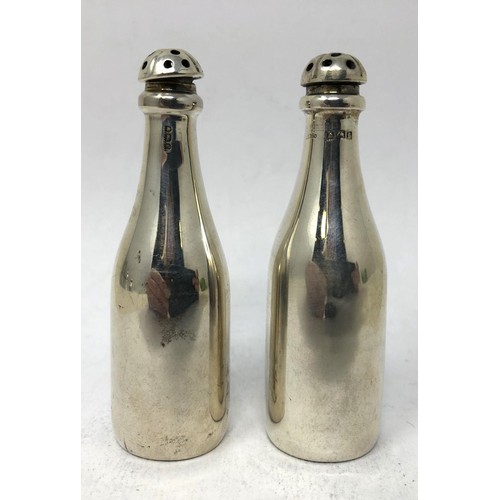 123 - A pair of Edward VII silver pepperettes, in the form of wine bottles, Birmingham 1905, 7 cm high (2)