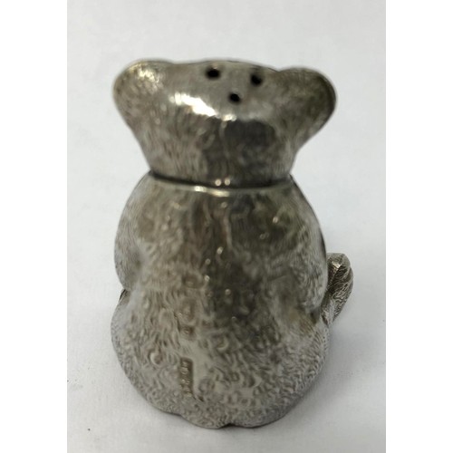 126 - An Edward VII silver pepperette, in the form of a seated teddy bear, Birmingham 1909, 3.5 cm high