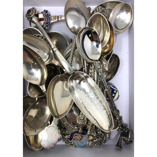 86 - Assorted silver coloured metal and other travel/commemorative spoons, some with enamel decoration