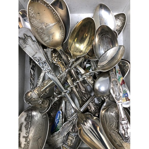 88 - Assorted silver coloured metal and other travel/commemorative spoons, some with enamel decoration