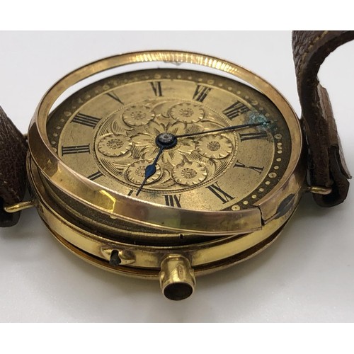 766 - A 9ct gold wristwatch, with Roman numerals, on a leather strap, in a later box, adapted from a fob w... 