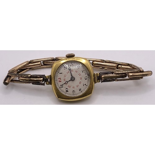 775 - A ladies yellow metal dress watch, on a expandable strap