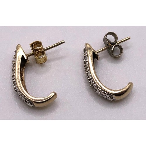 757 - A pair of 9ct gold diamond earrings