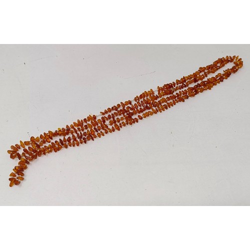 753 - An amber coloured bead necklace and assorted other costume jewellery