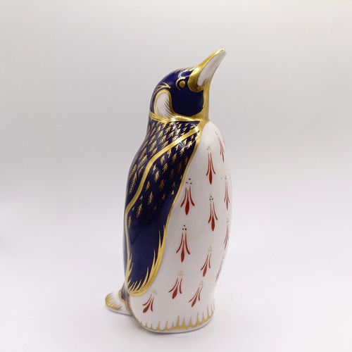 1027 - A Royal Crown Derby paperweight, in the form of a chameleon, another in the form of a penguin, and a... 