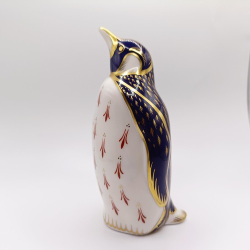 1027 - A Royal Crown Derby paperweight, in the form of a chameleon, another in the form of a penguin, and a... 