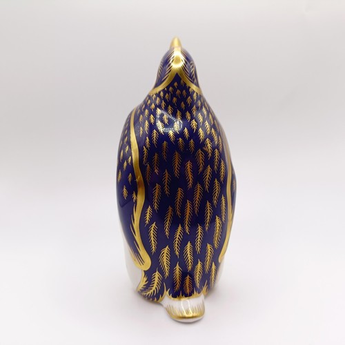 1027 - A Royal Crown Derby paperweight, in the form of a chameleon, another in the form of a penguin, and a... 