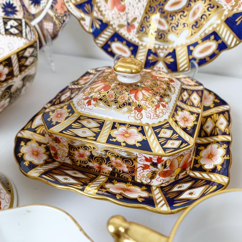 1031 - A Royal Crown Derby Imari pattern butter dish, a sucrier, a lidded trinket box, a tankard, two octag... 