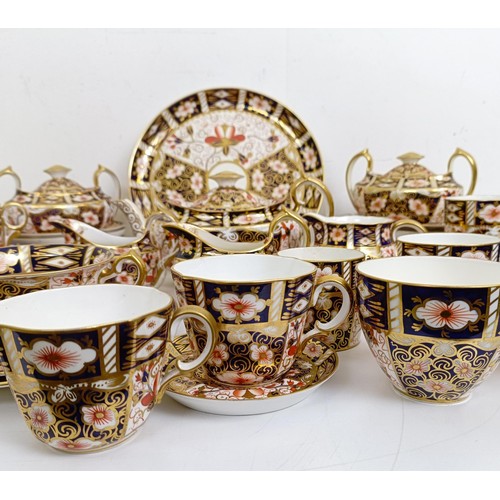 1033 - A Royal Crown Derby Imari pattern part tea service, comprising a teapot, two tureens, two cream jugs... 