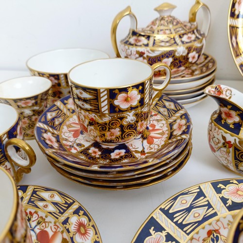 1033 - A Royal Crown Derby Imari pattern part tea service, comprising a teapot, two tureens, two cream jugs... 