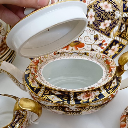 1033 - A Royal Crown Derby Imari pattern part tea service, comprising a teapot, two tureens, two cream jugs... 