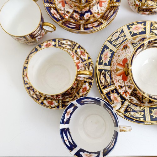 1033 - A Royal Crown Derby Imari pattern part tea service, comprising a teapot, two tureens, two cream jugs... 