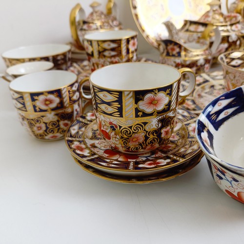 1033 - A Royal Crown Derby Imari pattern part tea service, comprising a teapot, two tureens, two cream jugs... 