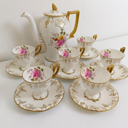 1037 - A Royal Crown Derby Vine pattern part tea service, comprising a teapot, six teacups, and six saucers... 