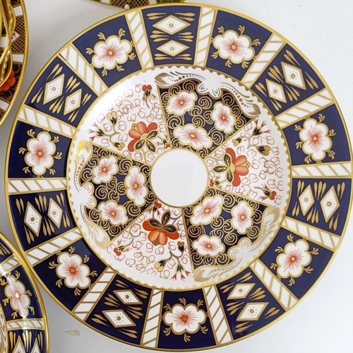 1038 - A Royal Crown Derby Old Imari holiday plate, a Yorkshire Rose plate, and eleven other Imari pattern ... 