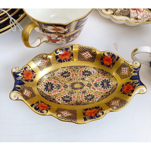 1040 - A Royal Crown Derby Imari pattern miniature coal scuttle, pattern 6299, two serving trays, two oval ... 