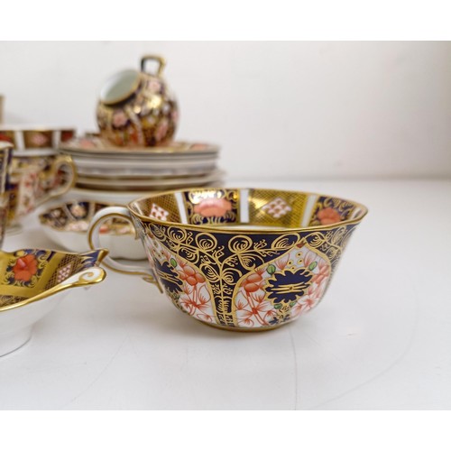 1040 - A Royal Crown Derby Imari pattern miniature coal scuttle, pattern 6299, two serving trays, two oval ... 