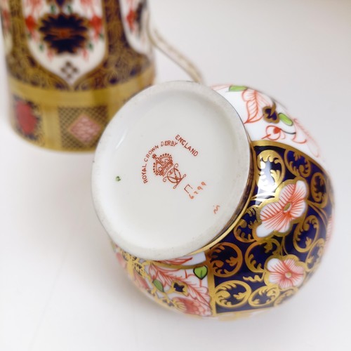 1040 - A Royal Crown Derby Imari pattern miniature coal scuttle, pattern 6299, two serving trays, two oval ... 