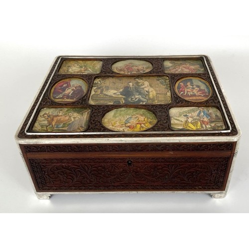 1060 - An Eastern carved wood box, the top inset with prints, with silver coloured metal mounts, 23 cm wide