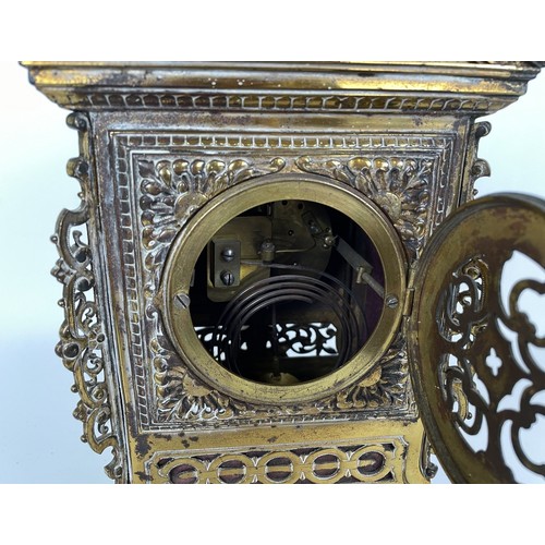 1062 - A mantel clock, the brass dial fitted an eight day movement, striking on a chime, in a brass case, d... 