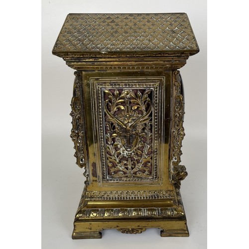 1062 - A mantel clock, the brass dial fitted an eight day movement, striking on a chime, in a brass case, d... 