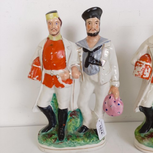 1074 - Two Staffordshire flatback figures, of a soldier and a sailor arm in arm, 32 cm high (2)