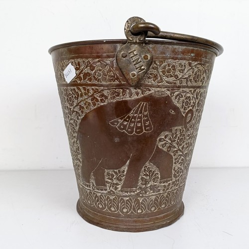 1086 - A Persian copper bucket, 60 cm high