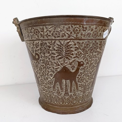 1086 - A Persian copper bucket, 60 cm high