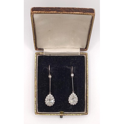 500 - A pair of early 20th century pear shaped diamond drop earrings