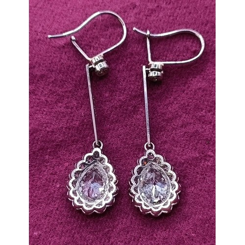 500 - A pair of early 20th century pear shaped diamond drop earrings