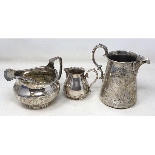 436 - A George V silver cream jug, 6.1 ozt, and two silver plated cream jugs (3)