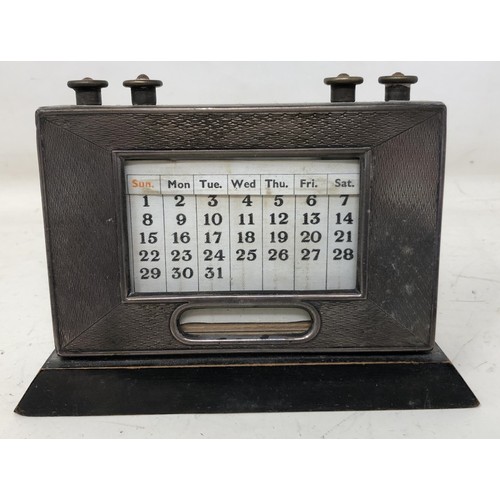 438 - A early 20th century desk calendar, with a silver mount, a cigarette case, and a cigar cutter (3)