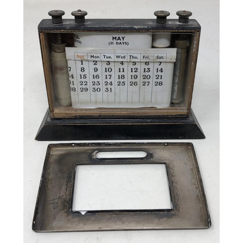 438 - A early 20th century desk calendar, with a silver mount, a cigarette case, and a cigar cutter (3)