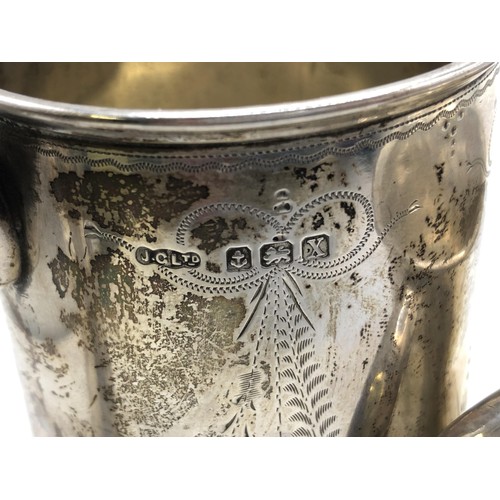 439 - A George V silver mug, Birmingham 1922, and another mug, 7 ozt (2)