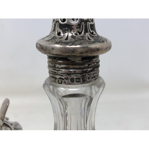 443 - A Victorian silver and mahogany cruet stand, with pierced decoration, London 1876, with three associ... 