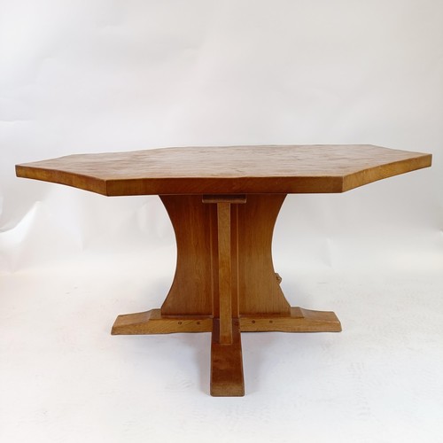 1207 - Robert Mouseman Thompson of Kilburn, an octagonal dining table, with an adzed top, 133 cm diameter, ... 