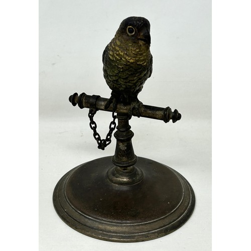 1138 - A cold painted bronze figure of a parrot on a perch, 13 cm high