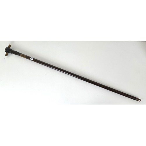 1151 - A late 19th/early 20th century novelty walking stick, with a bronze handle in the form of a fist hol... 