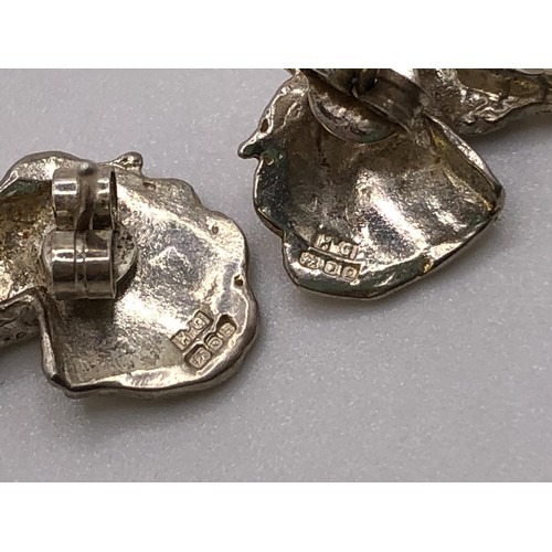 797 - A silver necklace, with horse head pendant, a pair of similar earrings, an amber and silver dress ri... 