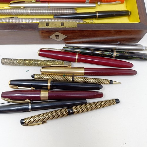 1129 - Assorted fountain and other pens, in a Victorian rosewood glove box, 24 cm wide