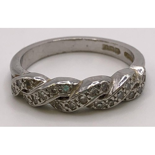 813 - A platinum and diamond ring, ring size L, 5.1 g all in