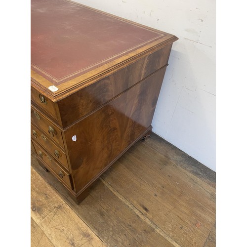 1254 - A walnut pedestal desk, of nine drawers, 140  cm wide