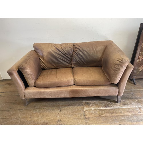 1246 - A brown leather double sofa, 170 cm wide, Note, this has been used as a dog bed