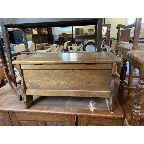 1281 - A 19th century mahogany pole screen, a mahogany side table, an oak oval table, a trunk, and two rugs