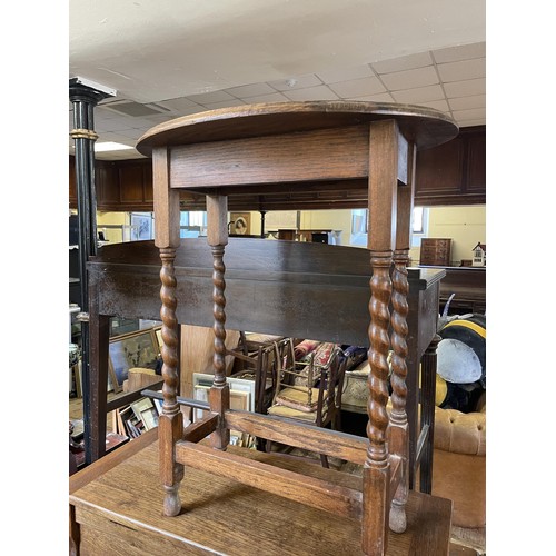 1281 - A 19th century mahogany pole screen, a mahogany side table, an oak oval table, a trunk, and two rugs