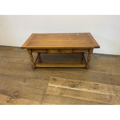 1250 - An oak side table, 72 cm wide, a coffee table, a wine table, a single chair, and a stool