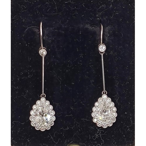 500 - A pair of early 20th century pear shaped diamond drop earrings