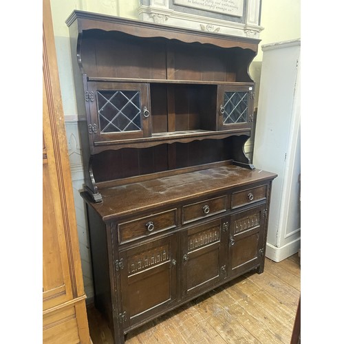 1288 - A burr walnut and oak bureau, 87 cm wide, a bookcase, a wicker shelf, a pine chest, an oak dresser, ... 