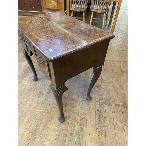 1295 - An 18th century style walnut lowboy, 74 cm wide